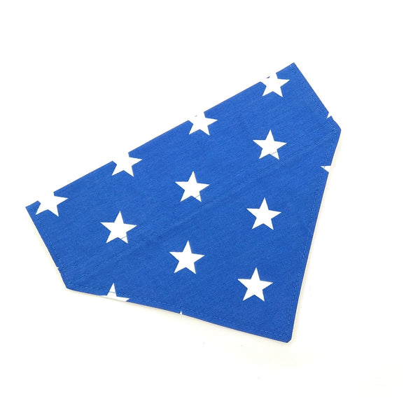 Front of blue with white stars dog bandana from above 