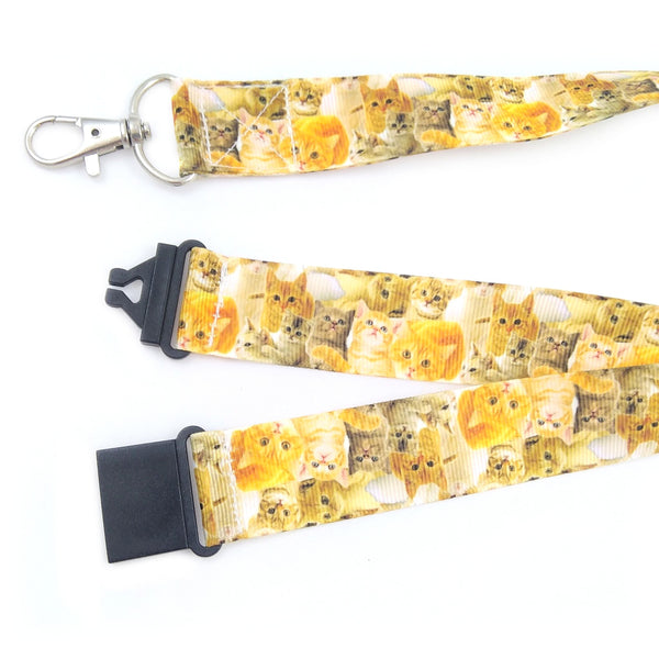 Close up of ginger cats lanyard with metal swivel clasp and black safety buckle
