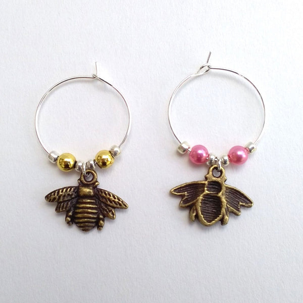 Pair of bronze coloured metal bee wine charms
