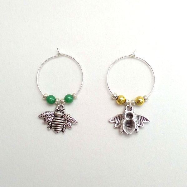 Pair of silver coloured bee wine charms