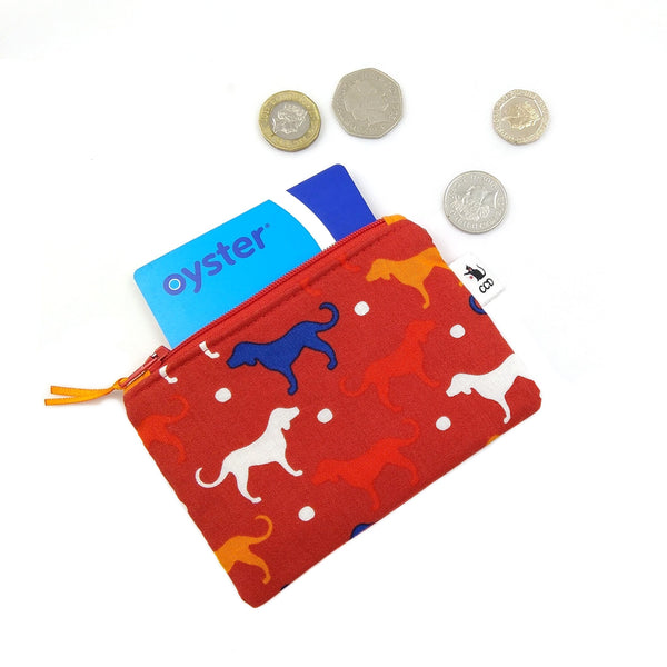 Red coin purse with Oyster card and money