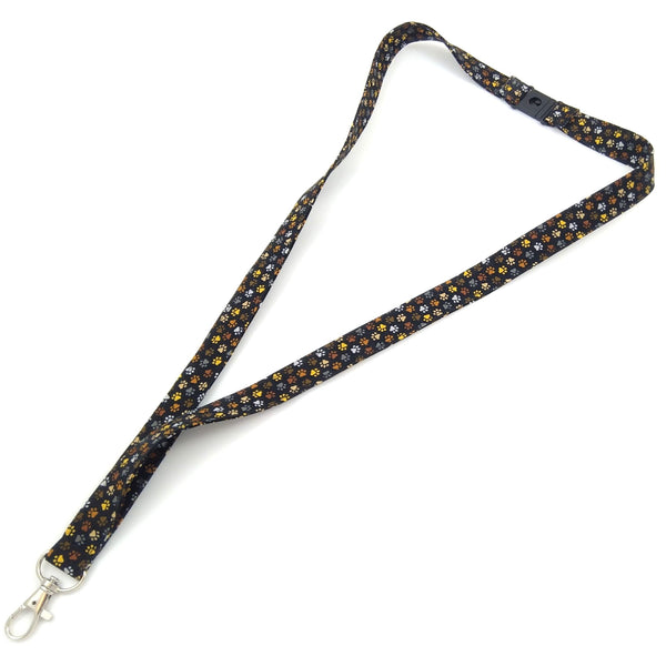 Full length black fabric lanyard with paw prints from above