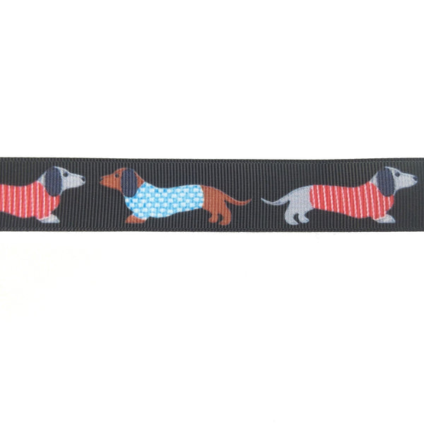 Close up of black ribbon with dachshunds