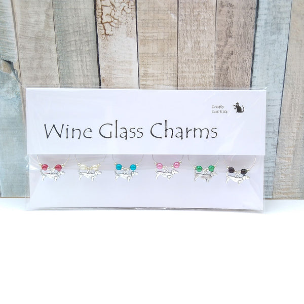 Small dachshund wine glass charms in gift packaging