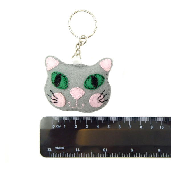 Grey cat head keyring with ruler to show size