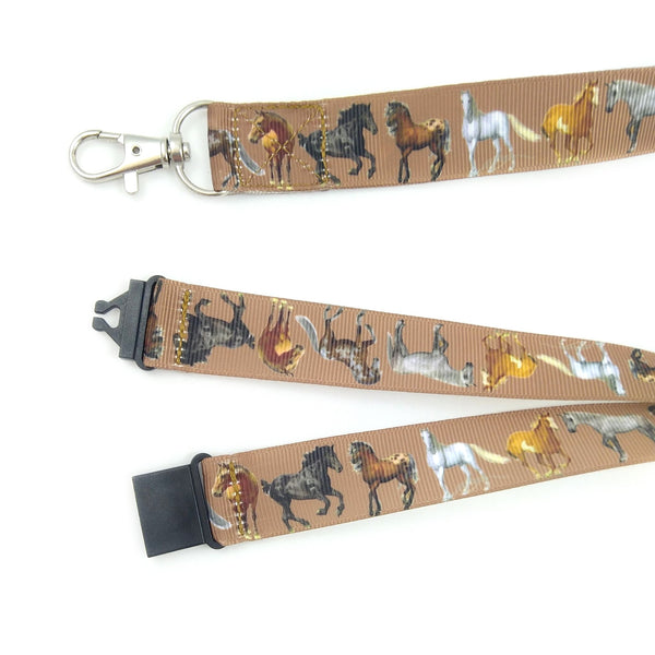 Close up of horse lanyard showing metal swivel clasp and black plastic safety buckle