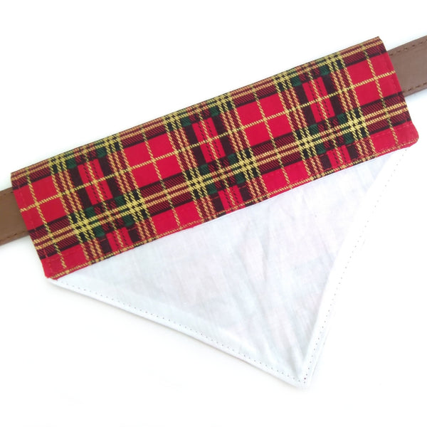 Back of red tartan cotton bandana with white lining on dog collar from above