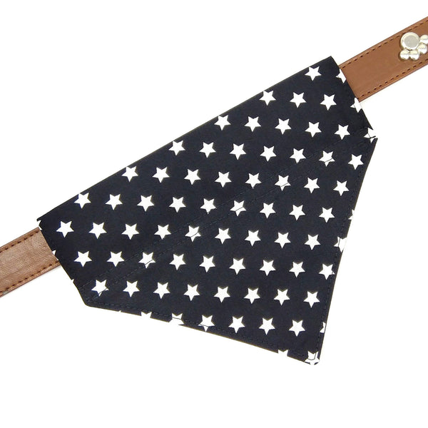 Front view of black and white stars dog bandana on collar laid flat and taken from above